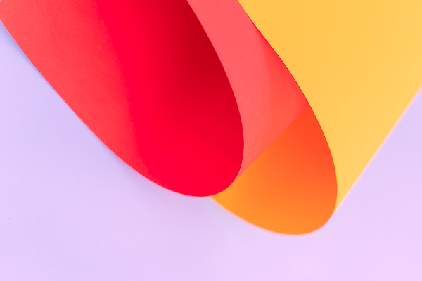Abstrakt bakgrundsbild i rött, gult och lila